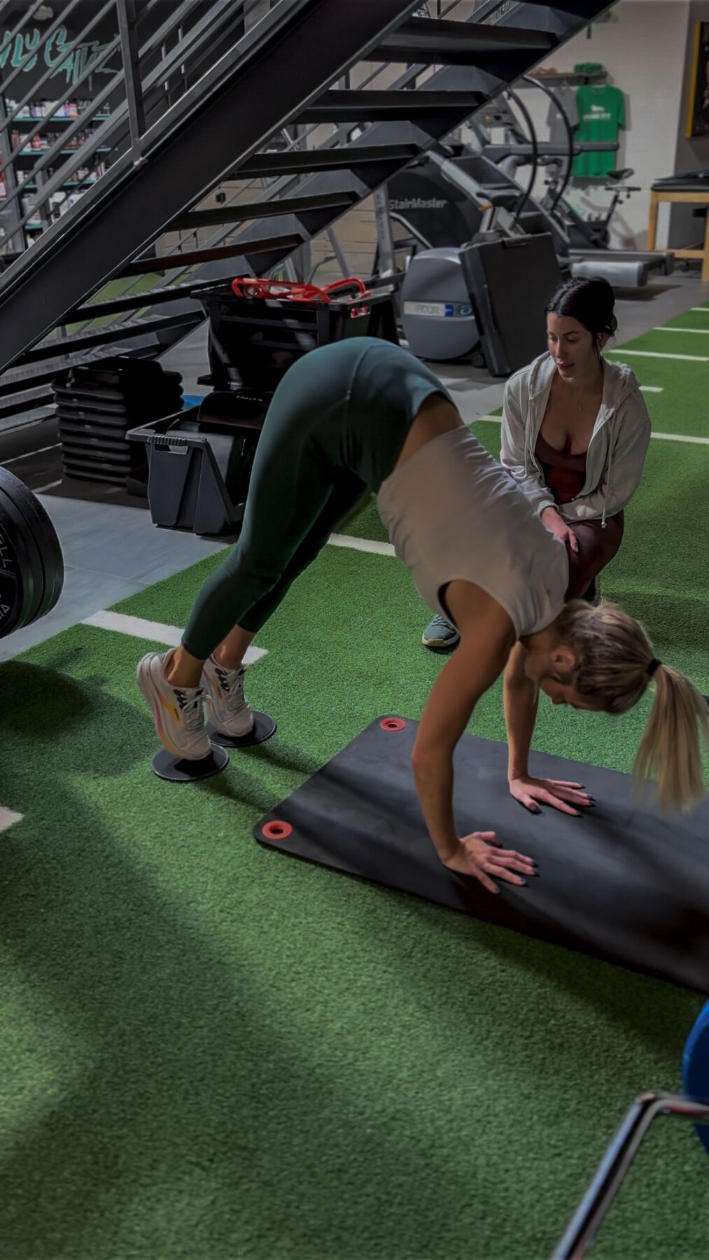 Member mid-lunge with Joe coaching form behind